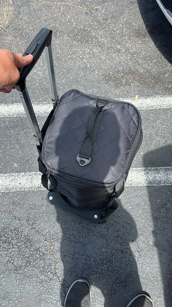 IVF medical courier hand-carrying cryogenic dry shipper through airport terminal