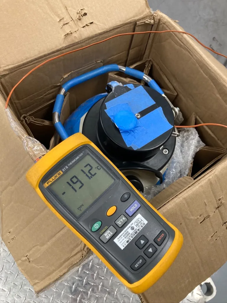 Fluke 51 II digital thermometer verifying cryogenic dry shipper at -191.2°C